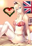  1girl arm_support blonde_hair blue_eyes bra braid breasts collarbone commentary_request crown eyebrows_visible_through_hair french_braid garter_belt garter_straps hair_between_eyes headband heart hms_warspite indoors jewelry kantai_collection kuurunaitsu large_breasts legs_crossed long_hair merry_christmas mini_crown navel on_bed open_mouth panties photo_(object) pillow red_bra red_panties ring sitting smile solo thigh-highs underwear union_jack warspite_(kantai_collection) wedding_ring white_legwear wreath 