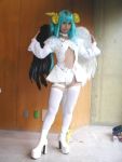 1girl arc_system_works asymmetrical_wings cosplay dizzy guilty_gear lowres photo solo thigh-highs wings 