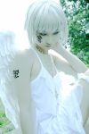  1boy androgynous angel asian cosplay cross crossdressinging dress facial_mark jewelry lowres makeup male_focus necklace original pale_skin photo short_hair solo tattoo trap white_hair white_wings wings 