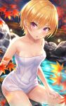  1girl autumn_leaves bangs bare_arms bare_shoulders blonde_hair blurry blurry_background blush breasts collarbone commentary_request covered_navel depth_of_field eyebrows_visible_through_hair feet_out_of_frame fence hair_between_eyes highres idolmaster idolmaster_shiny_colors leaf looking_at_viewer maple_leaf naked_towel night onsen outdoors parted_lips revision saijou_juri short_hair small_breasts solo towel urabi_(tomatohouse) violet_eyes water 