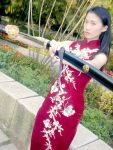  1girl asian china_dress chinese_clothes cosplay dress katana photo plant solo sword weapon 