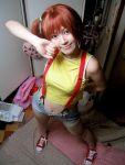  1girl asian cosplay denim denim_shorts from_above kasumi_(pokemon) looking_at_viewer no_socks photo pokemon ponytail redhead shoes shorts side_ponytail smile sneakers solo sumomo_(sumomonger) suspenders 