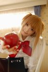  1girl amane_misa apple asian cosplay death_note food fruit holding holding_fruit photo solo 