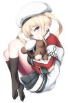  1girl bangs beret black_skirt blonde_hair blue_eyes capelet eyebrows_visible_through_hair fueru_nattou graf_zeppelin_(kantai_collection) hat kantai_collection kneehighs knees_up long_sleeves looking_at_viewer military_hat object_hug parted_lips simple_background skirt soles solo stuffed_animal stuffed_toy teddy_bear twintails wavy_hair white_background younger 