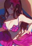  (fate) 1girl absurdres bikini breasts brown_hair cleavage collarbone fate/grand_order fate_(series) flower hair_flower hair_ornament hand_on_hip hibiscus highres large_breasts long_hair pink_eyes red_cucumber red_flower sarong scathach_(fate/grand_order) scathach_(swimsuit_assassin)_(fate) shiny shiny_skin solo swimsuit under_boob 