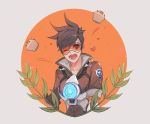  1girl ;d bangs bodysuit bomber_jacket brown_eyes brown_hair brown_jacket collarbone cupcake ear_piercing food goggles harness heart highres jacket leaf military_rank_insignia neosnim one_eye_closed open_mouth overwatch piercing plant short_hair sleeves_rolled_up smile solo spiky_hair spoken_heart strap teeth tracer_(overwatch) upper_body vambraces 