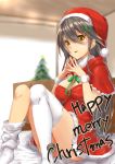  1girl blurry_background blush brown_hair capelet christmas_tree fingers_together fur-trimmed_dress hair_ornament haruna_(kantai_collection) hat holly_hair_ornament kantai_collection kyougoku_touya long_hair merry_christmas neck_ribbon parted_lips ribbon santa_costume santa_hat thigh-highs white_legwear yellow_eyes 