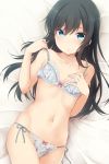  1girl asashio_(kantai_collection) black_hair blue_bra blue_eyes blue_panties bow bow_bra bow_panties bra breasts collarbone cowboy_shot floral_print hand_on_own_chest highres kantai_collection lace lace-trimmed_bra lace-trimmed_panties long_hair looking_at_viewer lying nagami_yuu navel on_back panties parted_lips print_bra print_panties side-tie_panties small_breasts solo strap_slip underwear underwear_only 