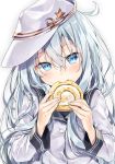  1girl biting blue_eyes blue_hair blush buttons cake cinnamon_roll eyelashes fingernails flat_cap flat_chest food hair_between_eyes hammer_and_sickle hat head_tilt hibiki_(kantai_collection) holding holding_food kakao_rantan kantai_collection long_hair long_sleeves looking_at_viewer matching_hair/eyes messy_hair school_uniform serafuku silver_hair simple_background solo star sweets swiss_roll upper_body verniy_(kantai_collection) white_background white_hat 