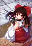  1girl bow cup detached_sleeves hair_bow hair_tubes hakurei_reimu looking_at_viewer looking_back magicxiang parted_lips petals red_bow red_eyes solo touhou wide_sleeves yunomi 