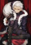  1boy absurdres alternate_costume archer belt_collar black_gloves black_santa_costume boots commentary_request curtains dark_persona dark_skin dark_skinned_male fate/grand_order fate/stay_night fate_(series) fur_coat fur_trim gloves hat highres rabbitseijin red_earrings sack santa_costume santa_hat solo white_hair yellow_eyes 