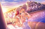  1girl blonde_hair blue_eyes bracelet breasts cleavage clouds dress flower hat hat_flower idolmaster idolmaster_cinderella_girls idolmaster_cinderella_girls_starlight_stage jewelry lens_flare long_hair necklace official_art ootsuki_yui open_mouth palm_tree smile solo sun_hat sundress sunset teeth town tree water white_dress 