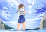  1girl :/ ass blue_eyes blue_swimsuit blush brown_hair closed_mouth clouds day from_behind fumarusan looking_back love_live! love_live!_sunshine!! one-piece_swimsuit outdoors partially_submerged profile school_uniform serafuku shirt short_sleeves sky solo standing swimsuit undressing watanabe_you water white_shirt 