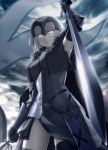  1girl ahoge armor armored_dress armpits bangs black_gloves black_legwear blonde_hair blurry bracer cape chains clouds depth_of_field elbow_gloves eyebrows_visible_through_hair fate/grand_order fate_(series) flag from_below frown fur-trimmed_cape fur_trim glint gloves haribote_(tarao) headpiece jeanne_alter looking_at_viewer looking_down ruler_(fate/apocrypha) short_hair sky solo sword thigh-highs weapon yellow_eyes 