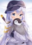  1girl aiguillette bird blue_eyes blush commentary covering_mouth epaulettes flat_cap hat hibiki_(kantai_collection) highres hitsukuya hug kantai_collection katana long_hair looking_at_viewer military military_uniform penguin silver_hair solo sword uniform weapon 