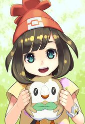  1girl :d bangs beak beanie bird bird_wings black_hair blue_eyes bob_cut bracelet cheek_squash chin_rest eyebrows_visible_through_hair feathered_wings female_protagonist_(pokemon_sm) fingernails floral_print hat holding jewelry leaf lips looking_at_viewer maruta_kentarou open_mouth owl parted_bangs poke_ball_theme pokemon pokemon_(creature) pokemon_(game) pokemon_sm red_hat rowlet shiny shiny_hair shirt short_hair short_sleeves smile solo tareme teeth tongue upper_body wings yellow_shirt z-ring 