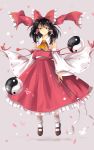  1girl ascot black_hair bobby_socks bow brown_eyes detached_sleeves floating gohei hair_bow hair_tubes hakurei_reimu highres mary_janes nontraditional_miko petals ringocha shoes skirt skirt_set socks touhou yin_yang_orb 