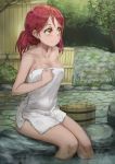  1girl absurdres blush breasts bucket cleavage collarbone commentary highres looking_to_the_side love_live! love_live!_sunshine!! naked_towel nude onsen outdoors partially_submerged redhead revision rock sakurauchi_riko short_hair sitting smile soaking_feet solo steam tied_hair towel tree water yellow_eyes yohan1754 