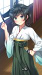  1girl bangs black_hair curtains furisode green_eyes hakama hat hat_removed headwear_removed highres imachireki japanese_clothes kantai_collection kimono matsukaze_(kantai_collection) meiji_schoolgirl_uniform mini_hat mini_top_hat short_hair smile solo swept_bangs top_hat wavy_hair window wooden_floor 