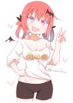  1girl bat_hair_ornament bike_shorts blush breasts cleavage clothes_writing commentary_request eyebrows_visible_through_hair fang fangs gabriel_dropout hair_ornament hair_rings head_tilt kitahara_tomoe_(kitahara_koubou) kurumizawa_satanichia_mcdowell long_hair looking_at_viewer medium_breasts open_mouth redhead shirt smile solo twitter_username violet_eyes 