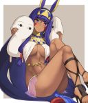  1girl bad_feet bracelet breasts dark_skin earrings egyptian egyptian_clothes facial_mark fate/grand_order fate_(series) full_body hai_ookami hairband highres hoop_earrings jewelry knees_up long_hair looking_at_viewer medium_breasts midriff navel nitocris_(fate/grand_order) pelvic_curtain purple_hair sitting under_boob very_long_hair violet_eyes 