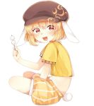  1girl animal_ears blonde_hair coda_(ankoprpr3700) commentary_request dango flat_cap floppy_ears food full_body hat looking_at_viewer looking_to_the_side midriff rabbit_ears red_eyes ringo_(touhou) shirt short_hair short_sleeves shorts simple_background smile solo touhou turning_head wagashi yellow_shirt 