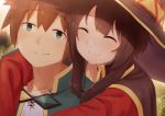  1boy 1girl black_hair blush brown_hair cape closed_eyes commentary_request dacchi hat highres hug hug_from_behind kono_subarashii_sekai_ni_shukufuku_wo! looking_at_viewer megumin satou_kazuma short_hair smile witch_hat 