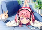  1girl absurdres bangs blurry closed_mouth couch crossed_ankles depth_of_field digital_media_player eyebrows_visible_through_hair feet_up hands_on_headphones headphones highres holding_headphones indoors kantoku kurumi_(kantoku) long_hair long_sleeves looking_at_viewer lying on_couch on_stomach original painting_(object) pink_hair plaid plaid_skirt plant pleated_skirt potted_plant rabbit red_skirt skirt sleeves_past_wrists smile solo sweater two_side_up violet_eyes wavy_hair white_sweater 
