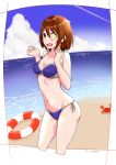  1girl absurdres beach bikini blue_bikini blush breasts brown_hair chabatake_ao cleavage clouds cowboy_shot crab furutaka_(kantai_collection) glowing glowing_eye heterochromia highres innertube kantai_collection navel ocean open_mouth short_hair side-tie_bikini solo swimsuit 