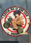  1girl abazu-red bikini_top black_hair breasts girls_und_panzer green_eyes ground_vehicle highres hoshino_(girls_und_panzer) jumpsuit large_breasts motor_vehicle motorcycle nose_art riding solo twitter_username 