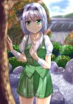  1girl bandage blue_sky breasts cleavage clouds dappled_sunlight day garden green_eyes hair_ribbon highres konpaku_youmu large_breasts light_smile pond puffy_short_sleeves puffy_sleeves revision ribbon rock shirt short_sleeves silver_hair skirt skirt_set sky solo sunlight sweat touhou tree vest wall wendell 