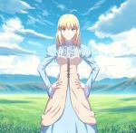  1girl ahoge alternate_costume blonde_hair blue_sky casual clouds fate/stay_night fate_(series) fateline_alpha field grassy green_eyes hair_between_eyes hands_on_hips highres juliet_sleeves long_hair long_sleeves mountain puffy_sleeves saber scenery sky smile solo wide_sleeves 