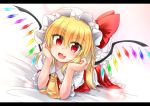  1girl :d alternate_hair_length alternate_hairstyle ascot bangs blonde_hair blush commentary eyes_visible_through_hair fang flandre_scarlet frilled_shirt_collar frills hat hat_ribbon head_rest highres long_hair looking_at_viewer lying m9kndi mob_cap on_bed on_stomach open_mouth red_eyes ribbon skirt skirt_set smile socks solo touhou vest wings 