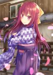  1girl bangs blurry blush bowl building closed_mouth cowboy_shot cup depth_of_field drainpipe eyebrows_visible_through_hair floral_print from_behind gradient_hair gurande_(g-size) hair_between_eyes hair_ribbon hakama hand_up highres hip_vent japanese_clothes kamikaze_(kantai_collection) kantai_collection kimono long_hair long_sleeves looking_at_viewer looking_back meiji_schoolgirl_uniform mug multicolored_hair obi outdoors petals pleated_skirt print_kimono purple_hair purple_hakama purple_kimono purple_skirt red_eyes redhead ribbon sash shelf shiny shiny_clothes shiny_hair shouji skirt sliding_doors smile solo standing stone_floor wide_sleeves window yagasuri yellow_ribbon 