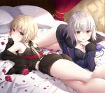  2girls ass bed bed_sheet black_jacket black_shirt black_shorts blonde_hair blue_jacket breasts canopy_bed cleavage cushion elbow_rest fate/grand_order fate_(series) from_behind hair_between_eyes indoors jacket jeanne_alter kneepits large_breasts looking_at_viewer lying masuishi_kinoto multiple_girls on_stomach parted_lips petals ruler_(fate/apocrypha) saber saber_alter shirt shorts silver_hair sleeveless sleeveless_shirt smile tank_top thighs yellow_eyes 