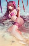  1girl bikini brown_hair derivative_work fate/grand_order fate_(series) flower hair_flower hair_ornament haohe_buguo hibiscus highres long_hair looking_at_viewer parted_lips partially_submerged pink_bikini red_eyes sarong scathach_(fate/grand_order) scathach_(swimsuit_assassin)_(fate) see-through smile solo swimsuit sword water weapon 
