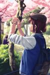  1girl backpack bag blurry brown_eyes brown_hair bush cabbie_hat cherry_blossoms dated depth_of_field hat highres jacket letterman_jacket open_mouth original park petals profile ramii signature sleeves_pushed_up smile solo_focus taking_picture tree upper_body watch watch 