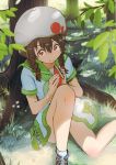  1girl bangs beret book braid branch brown_hair c: closed_mouth dress grass hair_between_eyes hat highres holding holding_book inami_hatoko knee_up leaf looking_at_viewer official_art original outdoors red_eyes sailor_collar sailor_dress school_uniform serafuku shoes sitting smile sneakers solo tree twin_braids 