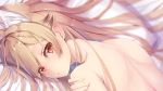  1girl animal_ears bed blonde_hair blurry cushion depth_of_field ezo_red_fox_(kemono_friends) fox_ears from_above hair_between_eyes highres kemono_friends long_hair looking_at_viewer lying on_stomach red_eyes tatapopo topless upper_body 