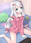  1girl :d artist_name bangs barefoot bed bedroom blue_eyes blush bow collarbone eromanga_sensei frills hand_up indoors izumi_sagiri long_hair long_sleeves looking_at_viewer on_bed open_mouth pajamas pink_bow signature silver_hair sitting smile solo stuffed_animal stuffed_octopus stuffed_toy stylus tablet tareme thighs uchuuneko wariza 