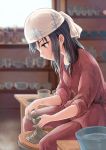  1girl black_hair blurry blush brown_eyes clay depth_of_field fujiwara_hajime furorida head_scarf idolmaster idolmaster_cinderella_girls long_hair potters_wheel pottery profile sitting solo 