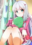  1girl absurdres aqua_eyes blue_hair bow eromanga_sensei hair_bow highres izumi_sagiri legs long_hair pink_bow rurika_seijin sitting sketch solo stuffed_animal stuffed_octopus stuffed_toy translated 