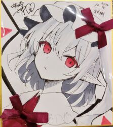  1girl :/ absurdres blush closed_mouth collared_shirt commentary_request crystal crystal_wings dated flandre_scarlet frilled_shirt_collar frills greyscale hat hat_ribbon highres long_hair looking_at_viewer mob_cap monochrome one_side_up photo_(medium) pointy_ears red_eyes red_vest ribbon sakizaki_saki-p shikishi shirt solo spot_color touhou traditional_media vest wings 