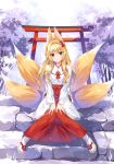  1girl animal_ears bangs blonde_hair blush breasts brown_eyes fox_ears fox_tail full_body hair_intakes hair_ornament hakama japanese_clothes knees_together_feet_apart long_hair long_sleeves looking_at_viewer miko multiple_tails original oryou outdoors sandals sitting sitting_on_stairs smile snowing solo stairs tabi tail torii tree v_arms white_legwear wide_sleeves 