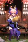  1girl absurdres animal_ears autumn_leaves blue_legwear blush breasts cleavage collarbone detached_sleeves fate/extra fate_(series) fox_ears fox_tail hair_ribbon highres holding_tail japanese_clothes large_breasts leaf looking_at_viewer looking_up pink_hair ribbon sitting solo tail tamamo_(fate)_(all) tamamo_no_mae_(fate) thigh-highs ye_zi_you_bei_jiao_ju_ge yellow_eyes zettai_ryouiki 