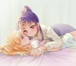  2girls asahina_mirai blonde_hair blush braid crown_braid eye_contact gobou_1000 hand_holding hand_on_forehead hug izayoi_liko long_hair looking_at_another mahou_girls_precure! multiple_girls nail_polish on_bed on_person ponytail precure purple_hair smile violet_eyes yuri 