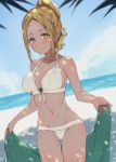  1girl beach bikini blonde_hair blush dappled_sunlight day highres looking_at_viewer ponytail smile solo sunlight swimsuit thigh_gap towel uni_(melm) white_bikini yellow_eyes 