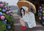  1girl absurdres animal animal_on_shoulder black_hair blue_eyes boots cat cat_on_shoulder eyebrows_visible_through_hair flower frog from_side highres holding holding_umbrella hydrangea long_hair maruhana on_shoulder original outdoors rain raincoat red_boots sidelocks solo squatting umbrella 