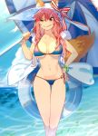  1girl animal_ears beach_umbrella bikini blue_bikini blush breasts cleavage clouds commentary fate/grand_order fate_(series) fox_ears fox_tail hat highres holding large_breasts long_hair looking_to_the_side menea navel ocean pink_hair sky smirk solo sun_hat swimsuit tail tamamo_(fate)_(all) tamamo_no_mae_(swimsuit_lancer)_(fate) umbrella yellow_eyes 