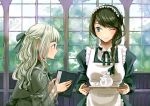  2girls book braid brown_hair crown_braid eye_contact green_eyes hair_ribbon highres holding holding_book inside long_hair looking_at_another maid multiple_girls oka_paya one_eye_closed open_book original profile ribbon side_glance smile teapot tray window yuri 